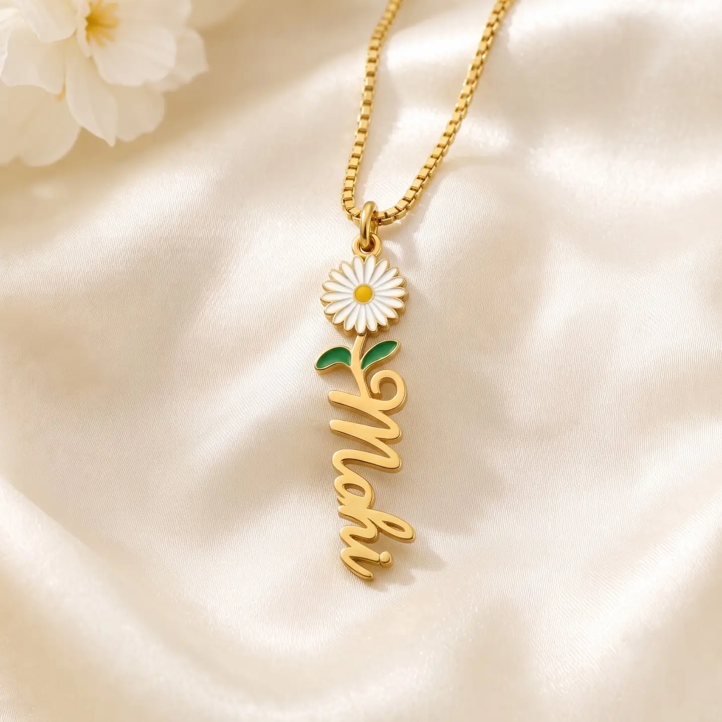 Flower Drop Name Necklace - Satin Detail Gold-tone vertical name pendant with a daisy flower on ivory satin