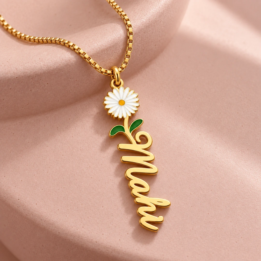 Flower Drop Name Necklace - On a pink display Flower Drop Name Necklace on a pink display