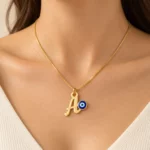 Blue Evil Eye Letter Pendant worn on a fine chain