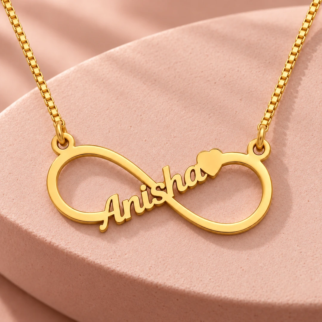 Personalized Infinity Name Necklace - On a pink display Personalized Infinity Name Necklace on a pink display