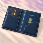 Open blue passport cover showing a passport and card in the interior pockets