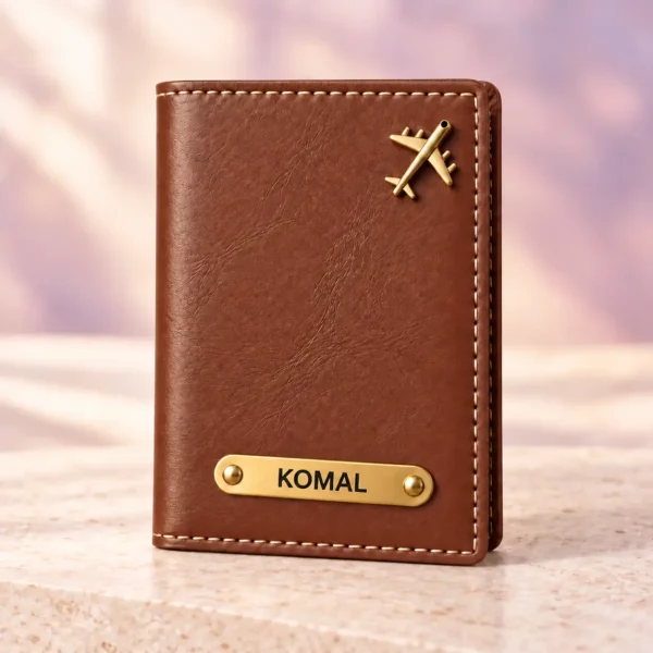 Brown personalized passport cover with a golden nameplate and airplane detail, front view