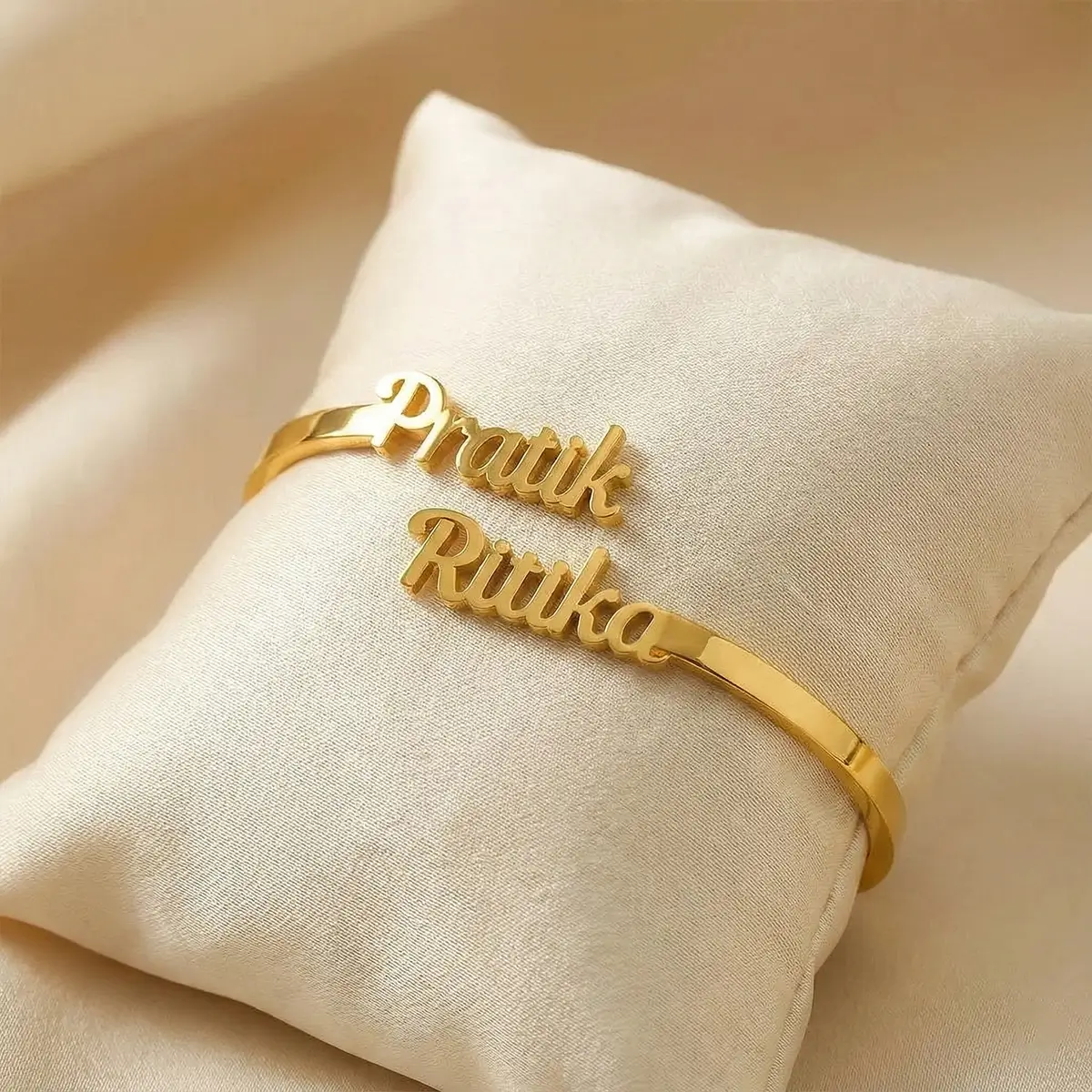 Personalized Couple Name Bracelet - On a light display cushion Personalized Couple Name Bracelet on a light display cushion
