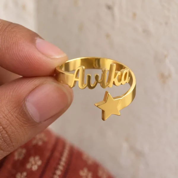 Personalized Star Name Ring held between fingers to show the personalized design