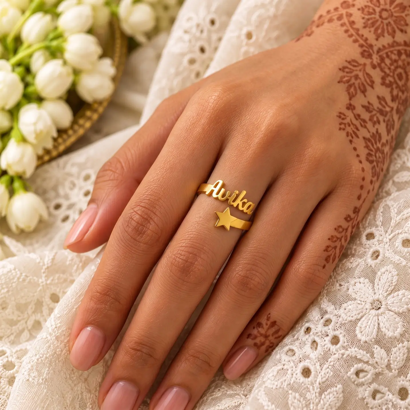Personalized Star Name Ring – Image 4 Personalized Star Name Ring worn on a hand with mehndi beside white embroidered fabric