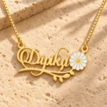 Flower and Leaf Name Necklace on a rough stone surface