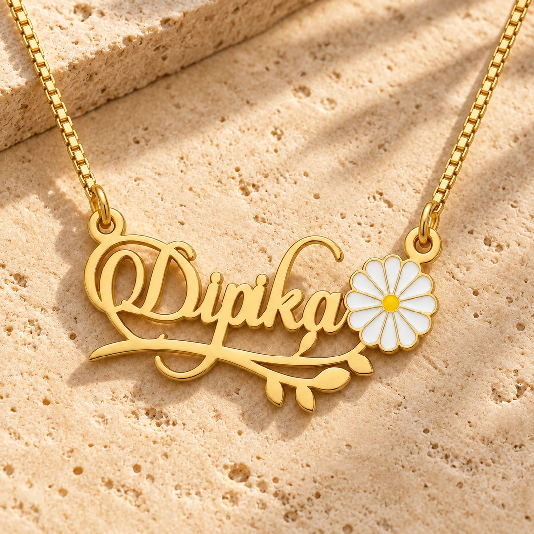 Flower and Leaf Name Necklace - On a rough stone surface Flower and Leaf Name Necklace on a rough stone surface