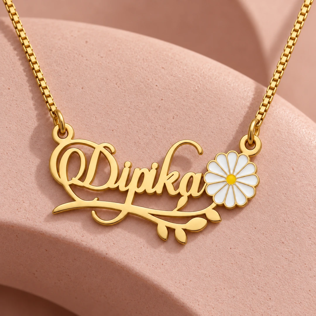 Flower and Leaf Name Necklace - On a pink display Flower and Leaf Name Necklace on a pink display