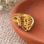 Two Hearts Personalized Love Ring displayed on a terracotta dish