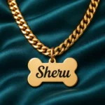 Personalized Bone Shape Dog Name Pendant with a gold-tone chain on dark green fabric