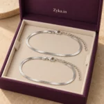 Silver Finish Snake Anklet shown as a pair in a purple display box