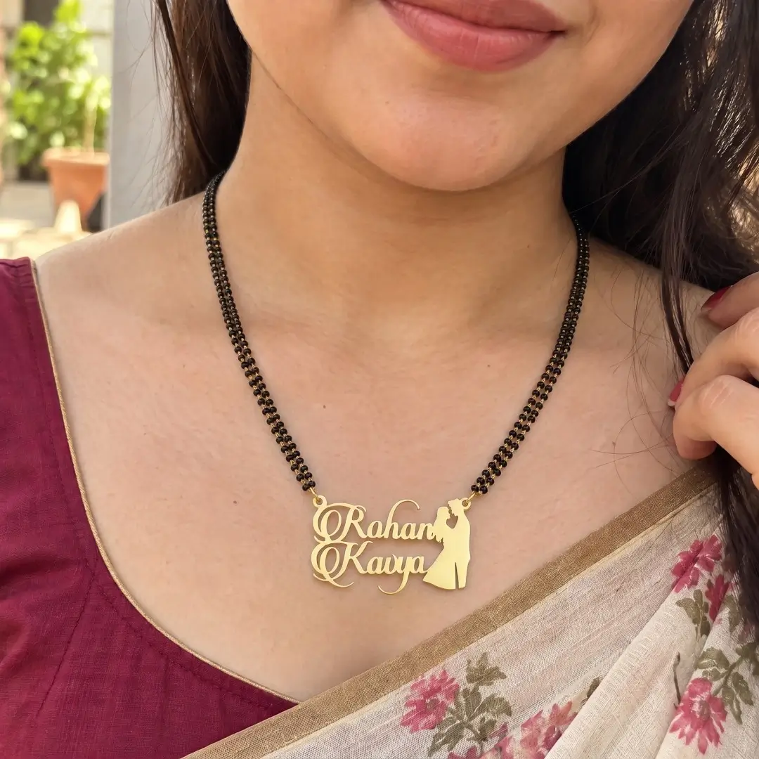 Romantic Couple Name Mangalsutra Pendant - With a black-beaded chain worn with a sari Romantic Couple Name Mangalsutra Pendant with a black-beaded chain worn with a sari
