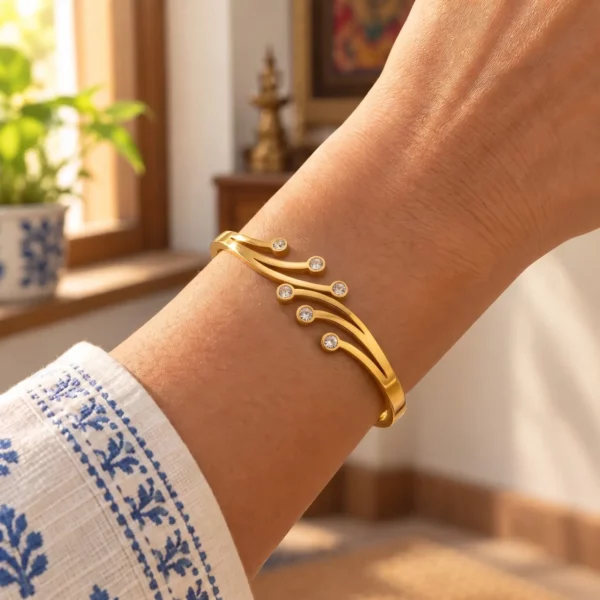 Golden Sparkle six stone cuff bracelet worn with a blue and white printed sleeve
