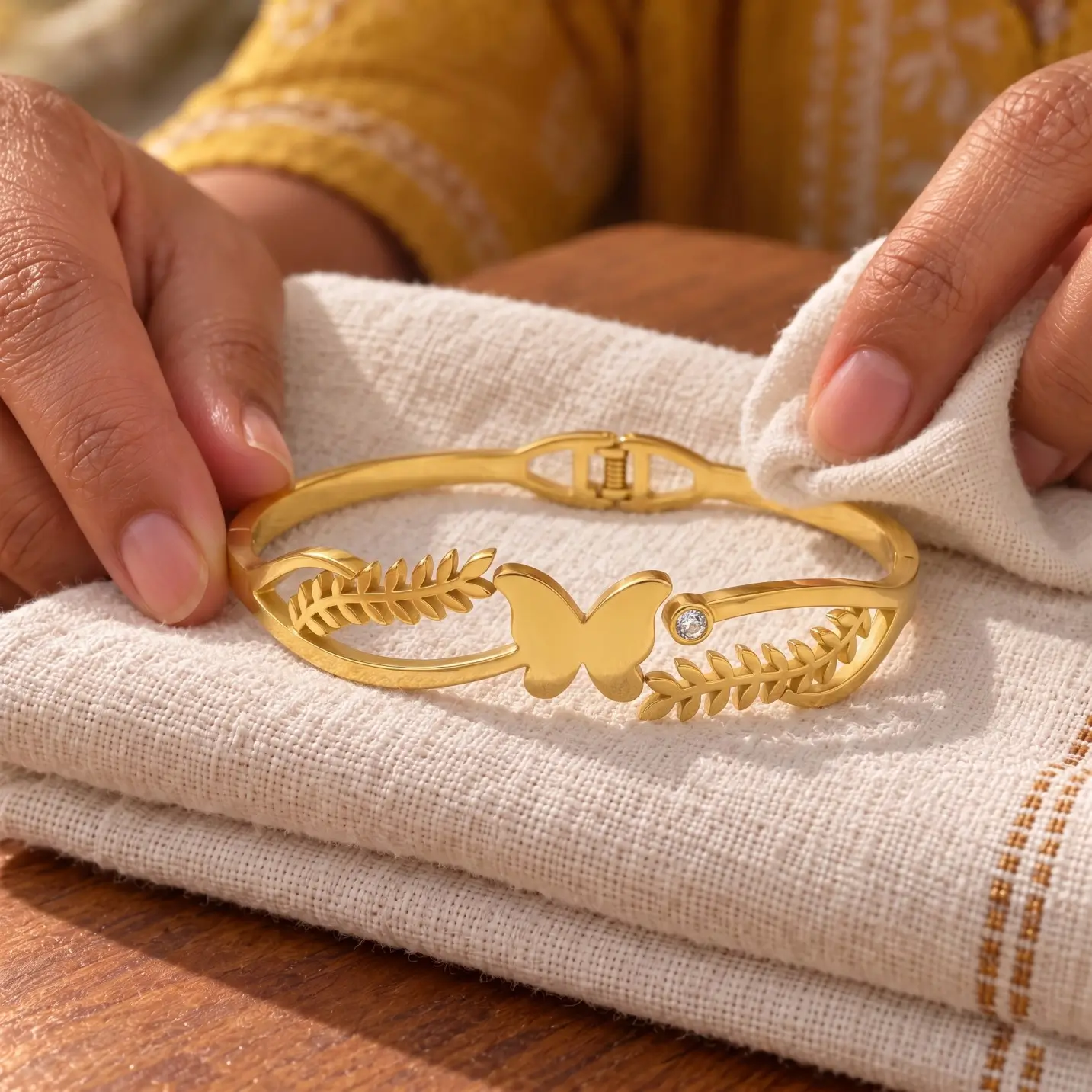 Golden Butterfly Leaf Cuff Bracelet - Linen Display Golden Butterfly Leaf Cuff Bracelet displayed on folded ivory linen