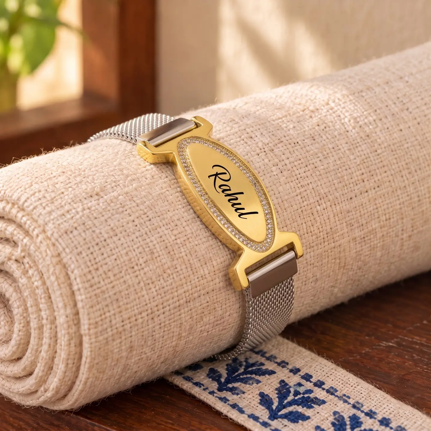Personalized Engraved Name Mesh Bracelet – Image 5 Personalized engraved name mesh bracelet displayed on a rolled linen cushion